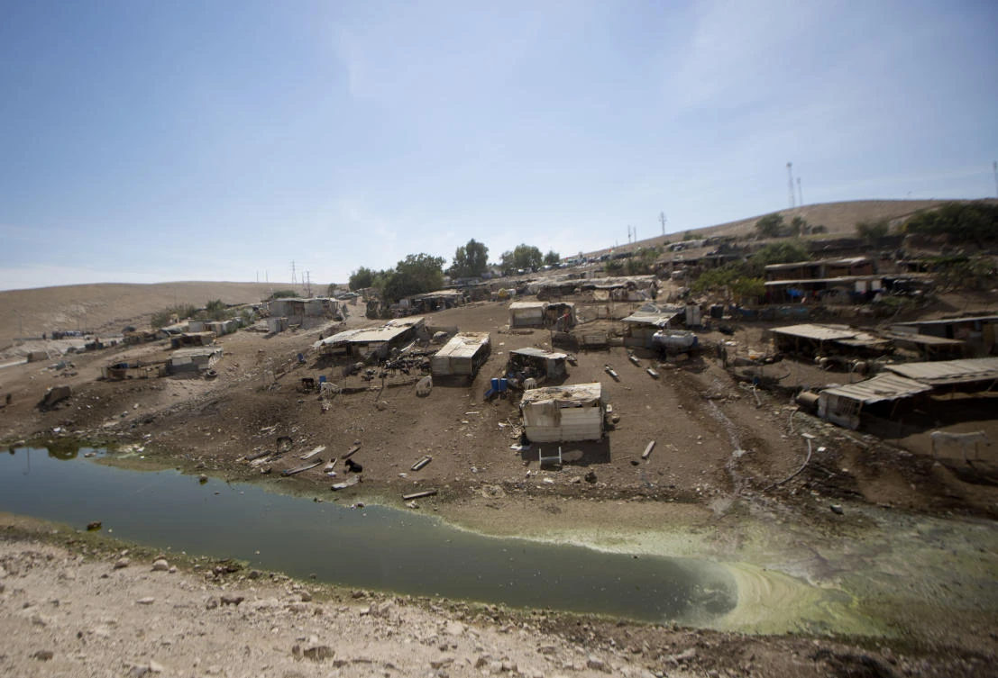 Sewage pool rings West Bank village awaiting demolition