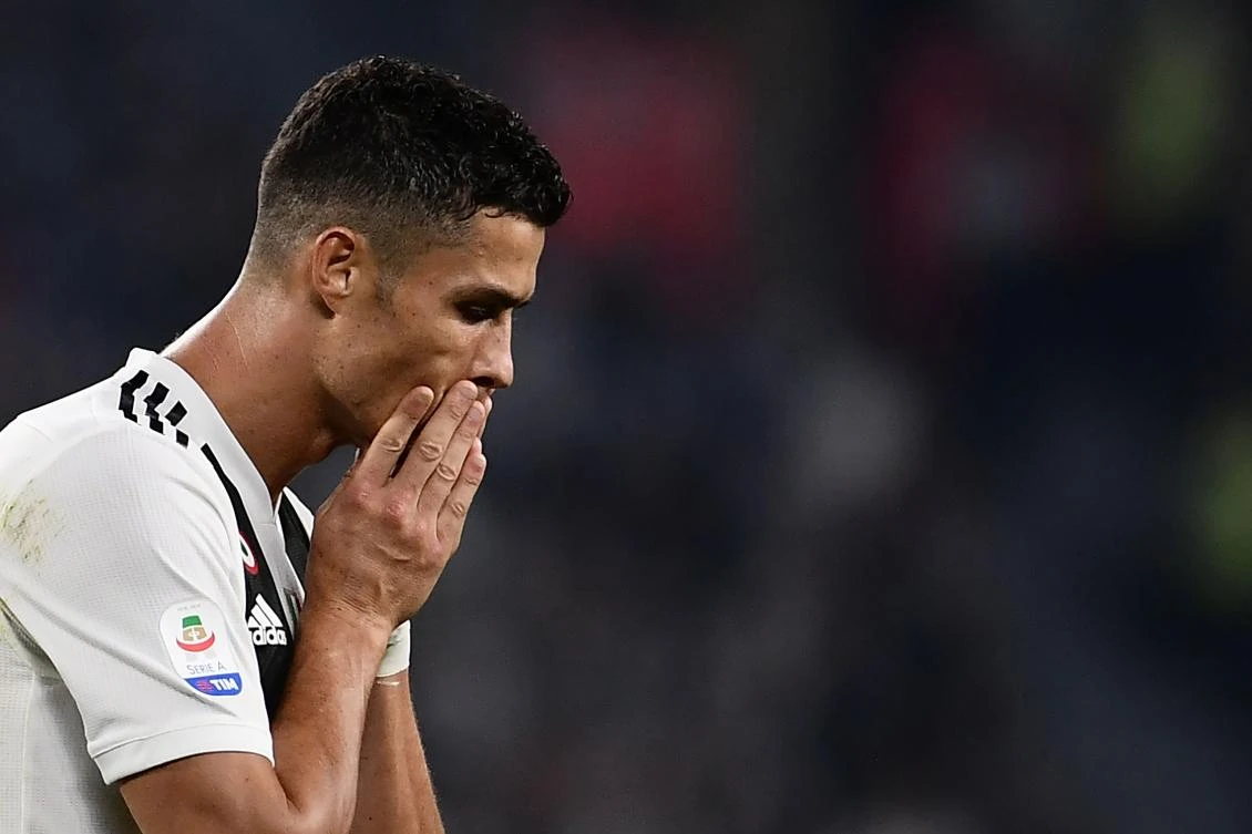 (FILES) In this file photo taken on September 29, 2018 Juventus' Portuguese forward Cristiano Ronaldo reacts during the Italian Serie A football match Juventus vs Napoli at the Juventus stadium in Turin. Cristiano Ronaldo is "doing well" and will be "ready to play" this weekend, despite being caught in the storm of rape allegations, Juventus coach Massimiliano Allegri said on October 5, 2018. Allegri said Ronaldo "is in the squad and ready to play" on Saturday when the winners of the past seven Serie A titles visit Udinese. / AFP / Marco BERTORELLO