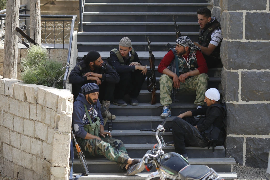 Three months after a stunning Daesh attack on a southeastern corner of Syria in which more than 200 people were killed and 30 women and children abducted, tensions are boiling over, and young men are taking up arms. (AP/Hassan Ammar)