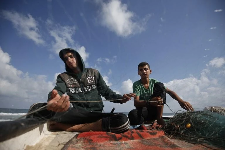 The fishing zone along the Gaza Strip’s coastline will be reduced to six nautical miles from nine nautical miles. (AFP)