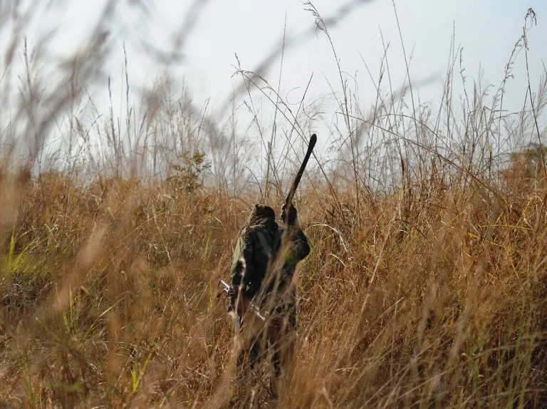 A ranger clears a path using a machete through thick elephant grass at the Garamba National Park, northeastern Democratic Republic of Congo (DRC)on February 3, 2016. (AFP)