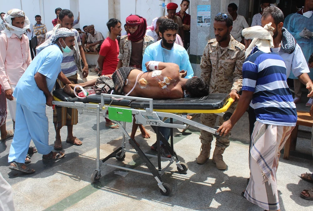 An injured Yemeni man is carried on a stretcher at a hospital following a bombing attack that targeted Yemeni forces in Aden's Khormaksar district on May 23, 2016. (File/AFP)