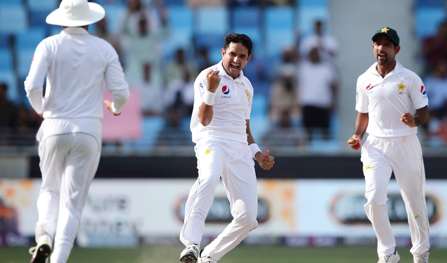 Pakistan's Mohammad Abbas, center, celebrates after taking the wicket of Australia's Aaron Finch during their test match in Dubai, UAE, on Wednesday, Oct. 10, 2018. (AP Photo/Kamran Jebreili)