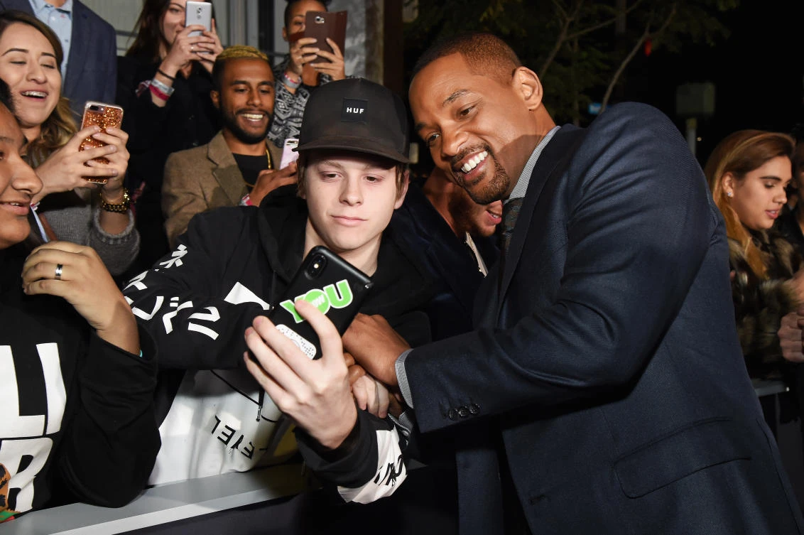 Will Smith takes a photo with a fan. (AFP)
