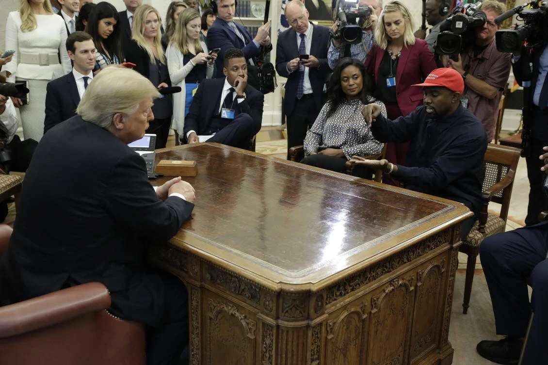 Rapper Kanye West speaks to President Donald Trump and others in the Oval Office of the White House, Thursday, Oct. 11, 2018, in Washington. (AP)