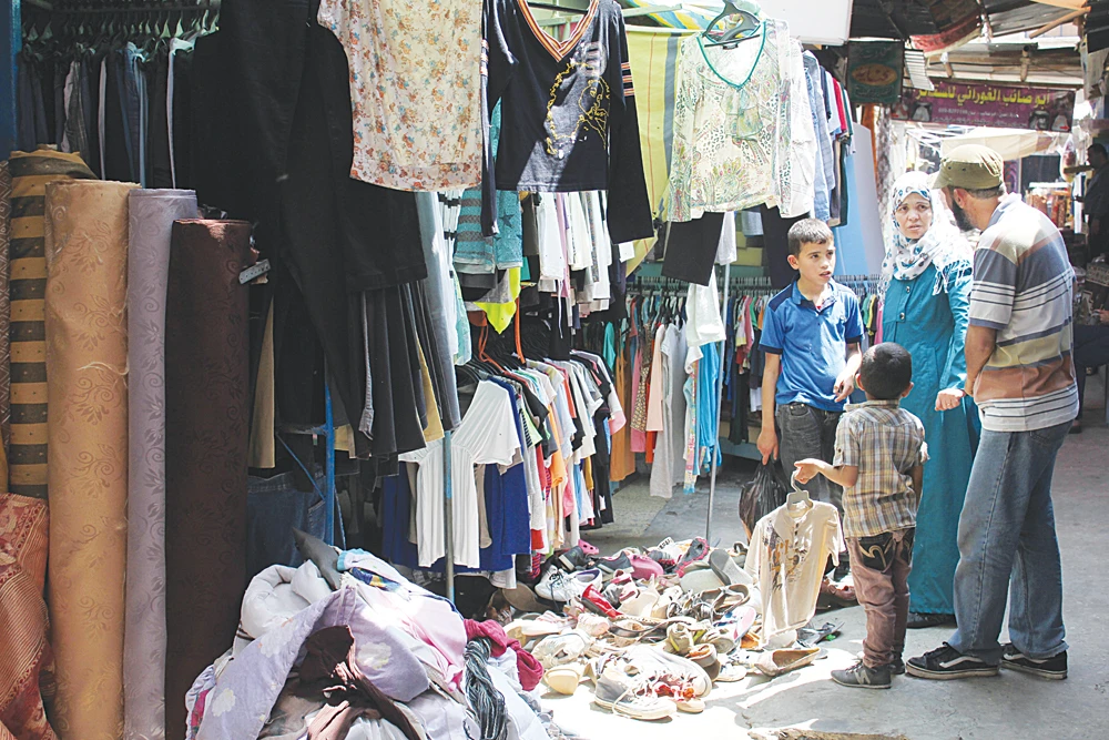 Gaza hardship brings new season for second-hand clothes