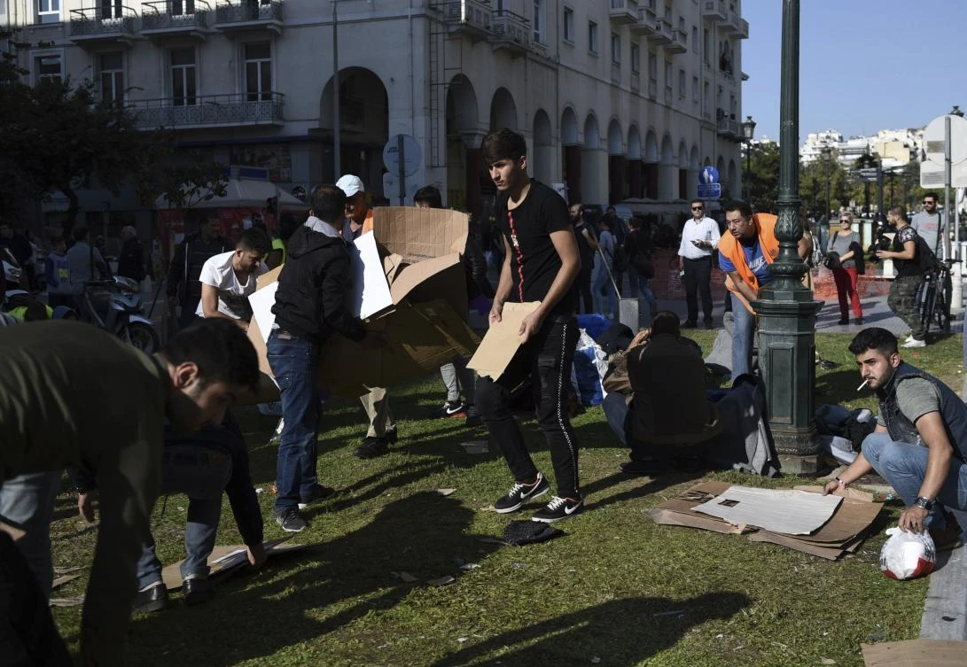Migrants clear the Aristotelous Square in the northern Greek city of Thessaloniki, Monday, Oct. 8, 2018. (AP Photo/Giannis Papanikos)
