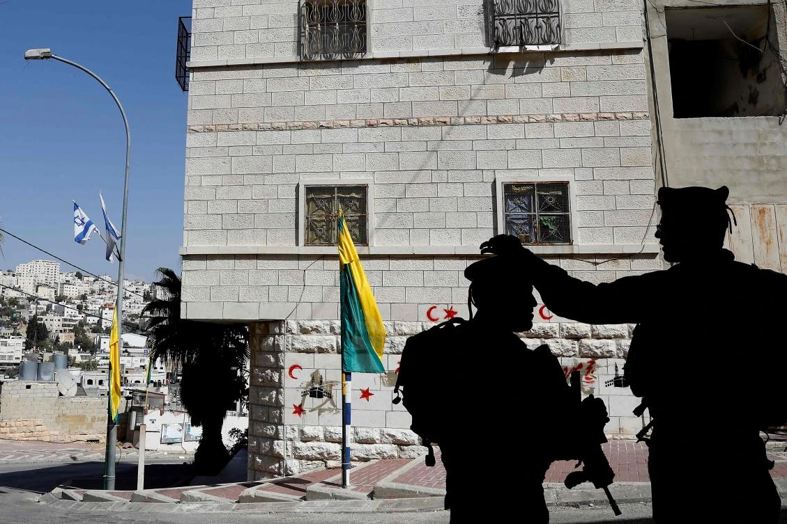 The Hebron units are to be built on Shuhada Street, once a bustling shopping street leading to a holy site where the biblical Abraham is believed to have been buried. (AFP)