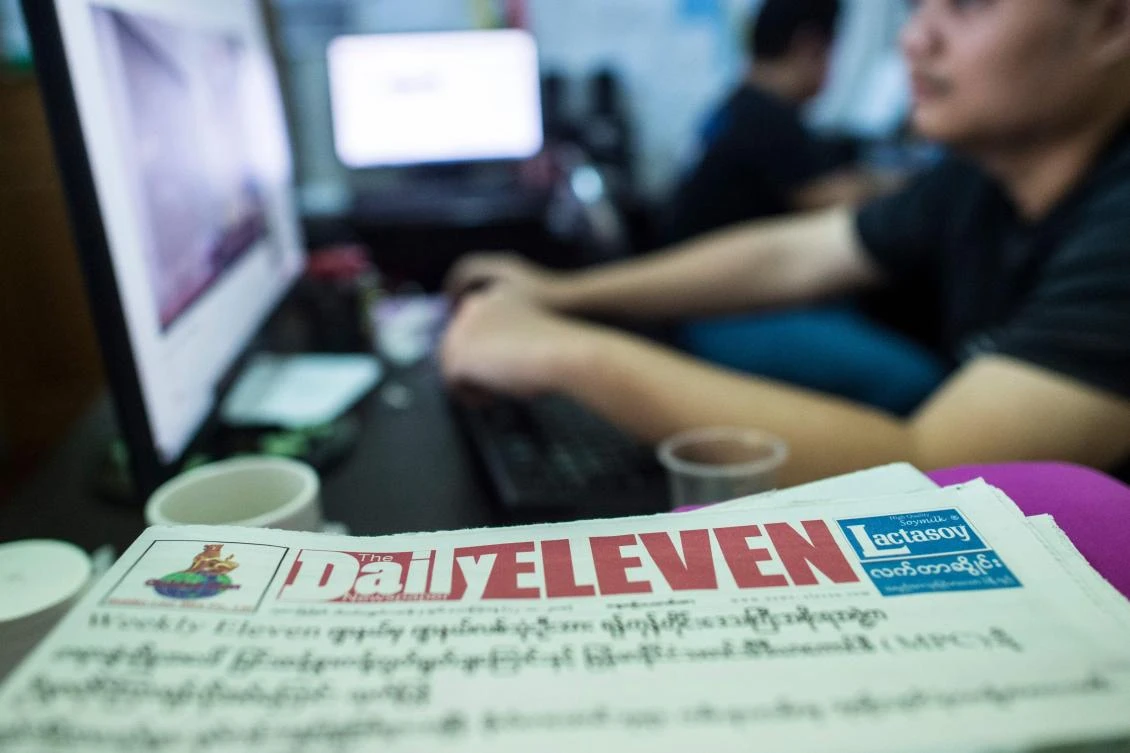 A Myanmar journalist of the privately owned Eleven Media Group works in the company's newsroom in Yangon on October 12, 2018. (AFP)