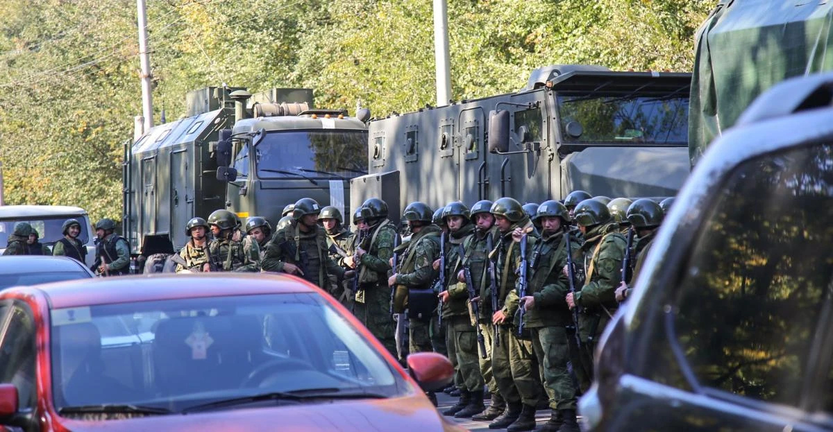 Special forces servicemen patrol outside the college in the city of Kerch. (AFP)
