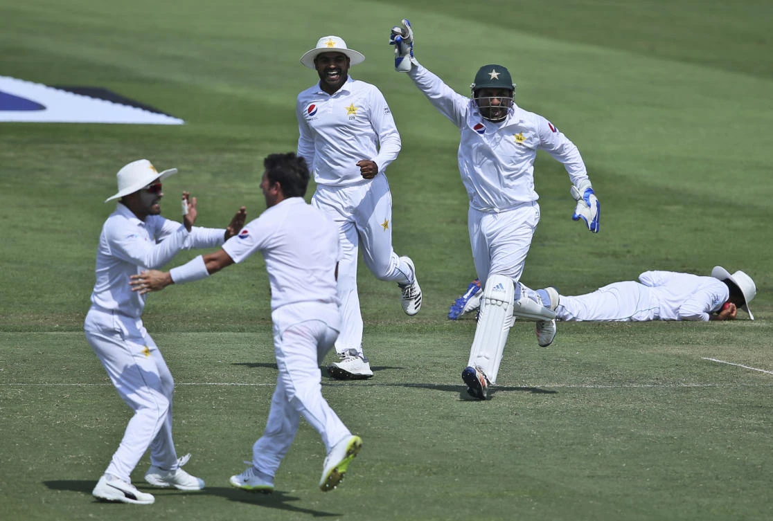 Pakistan's players celebrate dismissal of Australia's Mitchell Marsh during their test match in Abu Dhabi, United Arab Emirates, Wednesday, Oct. 17, 2018. (AP)