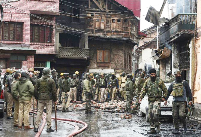 Indian troops stands at the site were a gun battle took place between suspected militants and Indian government forces in downtown Srinagar on Wednesday, October 17. (AFP)
