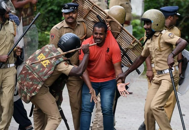Clashes erupted in India on Wednesday, October 17, as traditionalists tried to stop women visiting one of Hinduism’s most sacred temples, with police waving batons charging stone-throwing protestors. (AFP)
