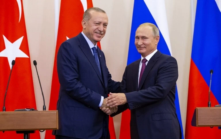 Russia and Turkey reached an agreement last month — during a summit between Turkish President Recep Tayyip Erdogan, left, and Russian leader Vladimir — to set up a demilitarized zone around Idlib. (AFP)