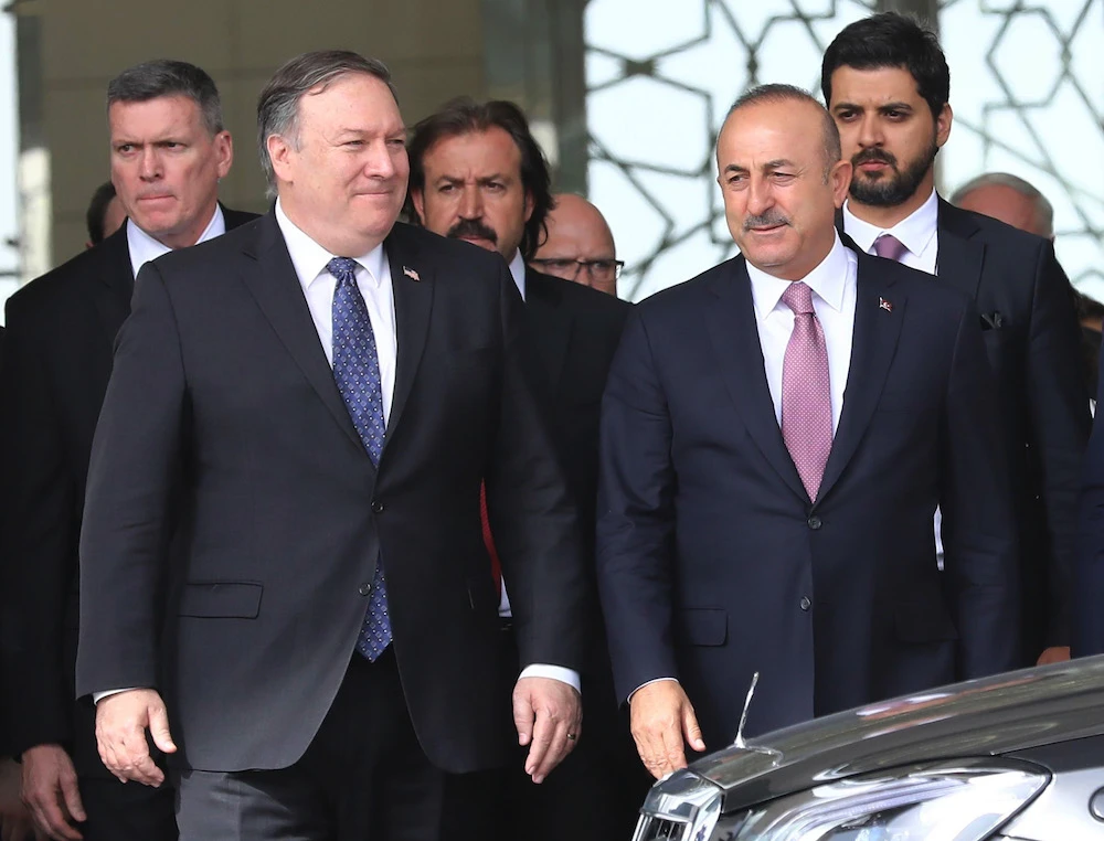 US Secretary of State Mike Pompeo and Turkish Foreign Minister Mevlut Cavusoglu (R) leave their meeting at Ankara Esenboga Airport on Oct. 17. (AFP)