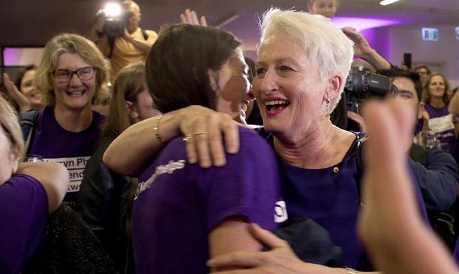 Independent candidate Kerryn Phelps, right, is congratulated by supporters as she arrives for a Wentworth by-election evening function at North Bondi Life Saving Club in Sydney on Oct. 20, 2018. (Chris Pavlich/AAP Image via AP)