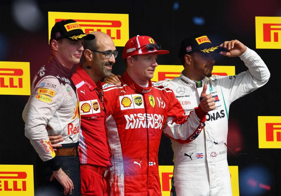 Race winner Kimi Raikkonen of Finland and Ferrari, second placed Max Verstappen of Netherlands and Red Bull Racing and third placed Lewis Hamilton of Great Britain and Mercedes GP celebrate on the podium after the United States Grand Prix. (AFP)