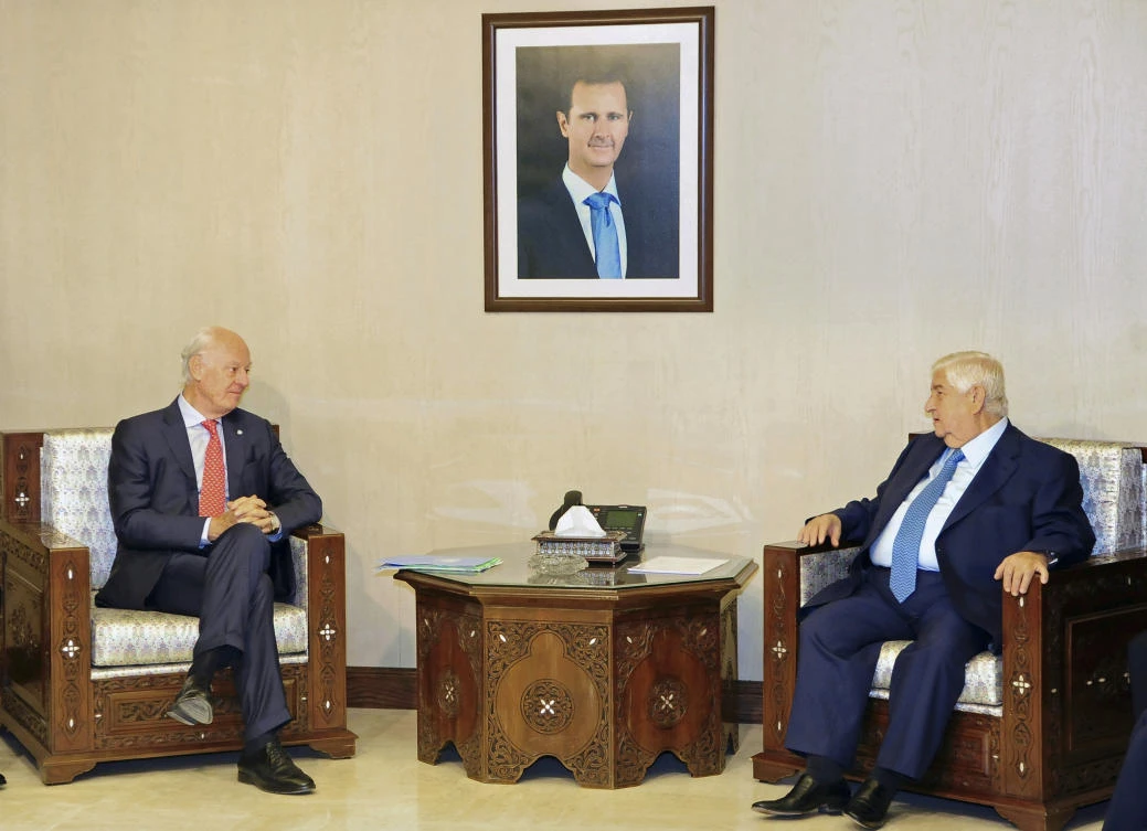 In this photo released by the Syrian official news agency SANA, Syria’s Foreign Minister Walid Al-Moallem, right, meets with UN Special Envoy for Syria Staffan de Mistura, in Damascus, Syria, Wednesday, Oct. 24, 2018. (SANA/AP)