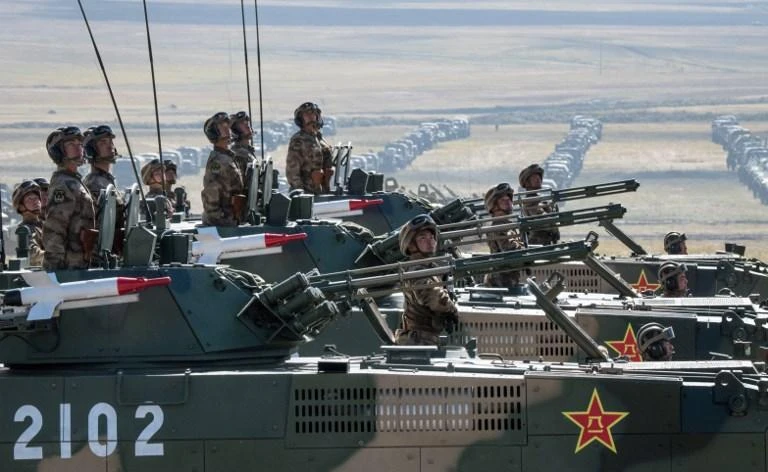 Chinese troops and military equipment parade at the end drills at Tsugol training ground in Siberia, on September 13. (AFP)