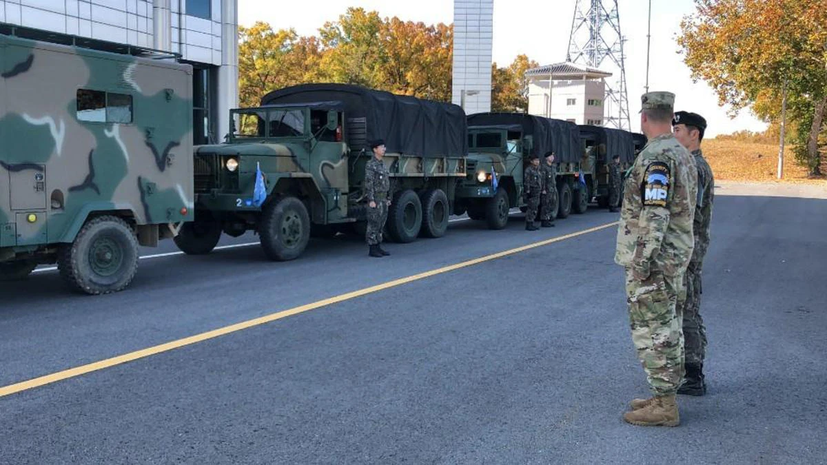 A US and a South Korean army soldier stand before leaving from the border village of Panmunjom on Thursday, October 25. (South Korea Defense Ministry via AP)