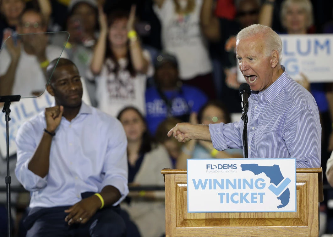 Former vice president Joe Biden and Florida Democratic gubernatorial candidate Andrew Gillum during a campaign rally at the University of South Florida, in Tampa, on Monday. (AP Photo)