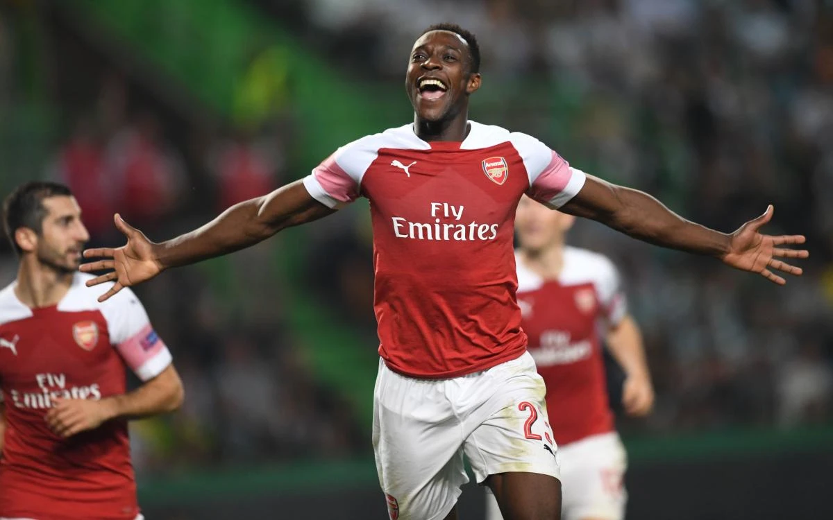 Arsenal's English striker Danny Welbeck celebrates after scoring a goal during the UEFA Europa League group E football match against Sporting Lisbon at the Alvalade stadium. (AFP)