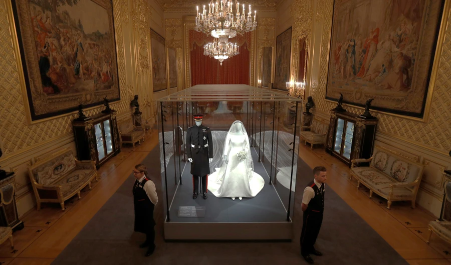 Meghan’s gown and the tiara will likely overshadow Harry’s wedding outfit, which is also on display. (Reuters)