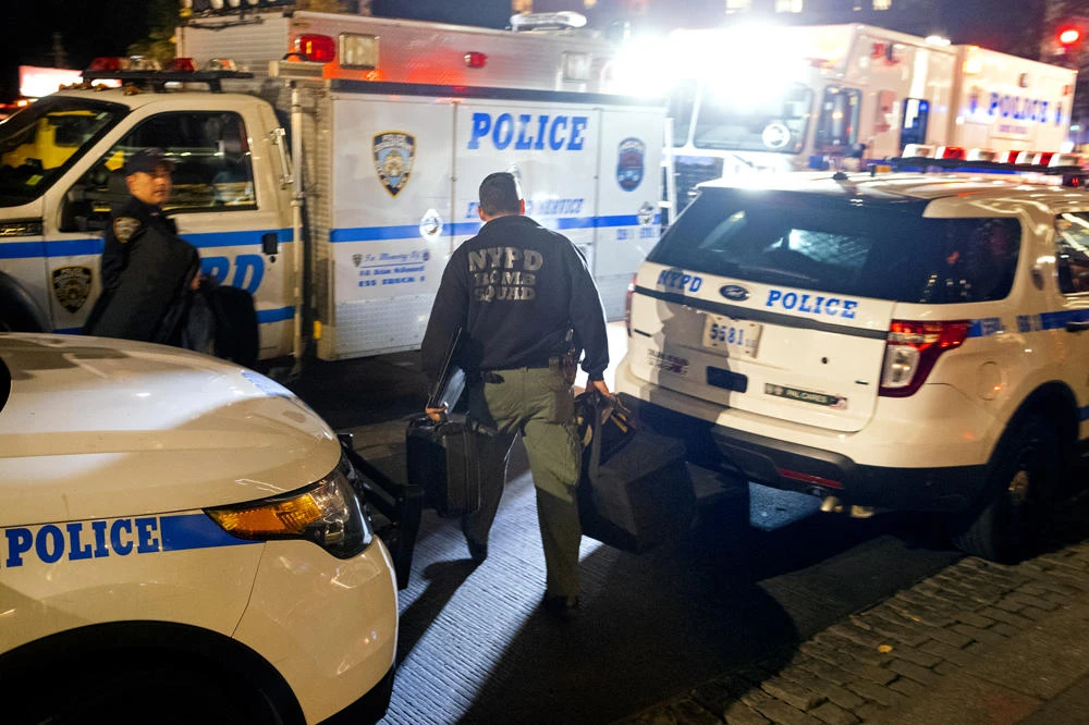 New York City police officers, and members of the bomb squad, clear the scene after a report of a possible suspicious package was called in at the Time Warner Center on Oct. 25, 2018, in New York. (AP Photo/Craig Ruttle)