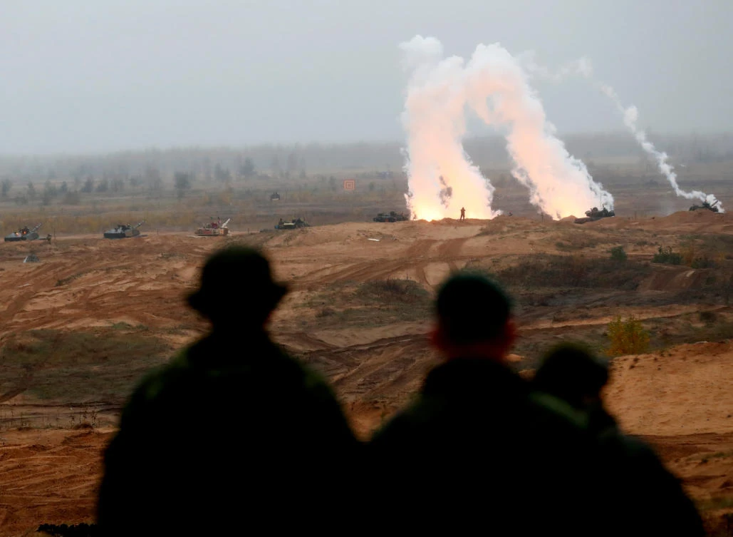 Soldiers of the NATO enhanced Forward Presence battle goup look on during the Iron Tomahawk exercise in Adazi, Latvia on Tuesday, October 23. (Reuters)
