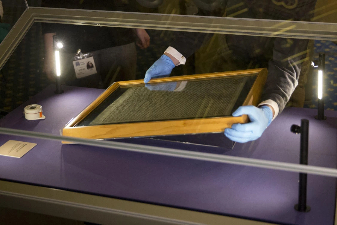 The Salisbury Cathedral 1215 copy of the Magna Carta is installed in a glass display cabinet in this February 5, 2015 photo. (AP)