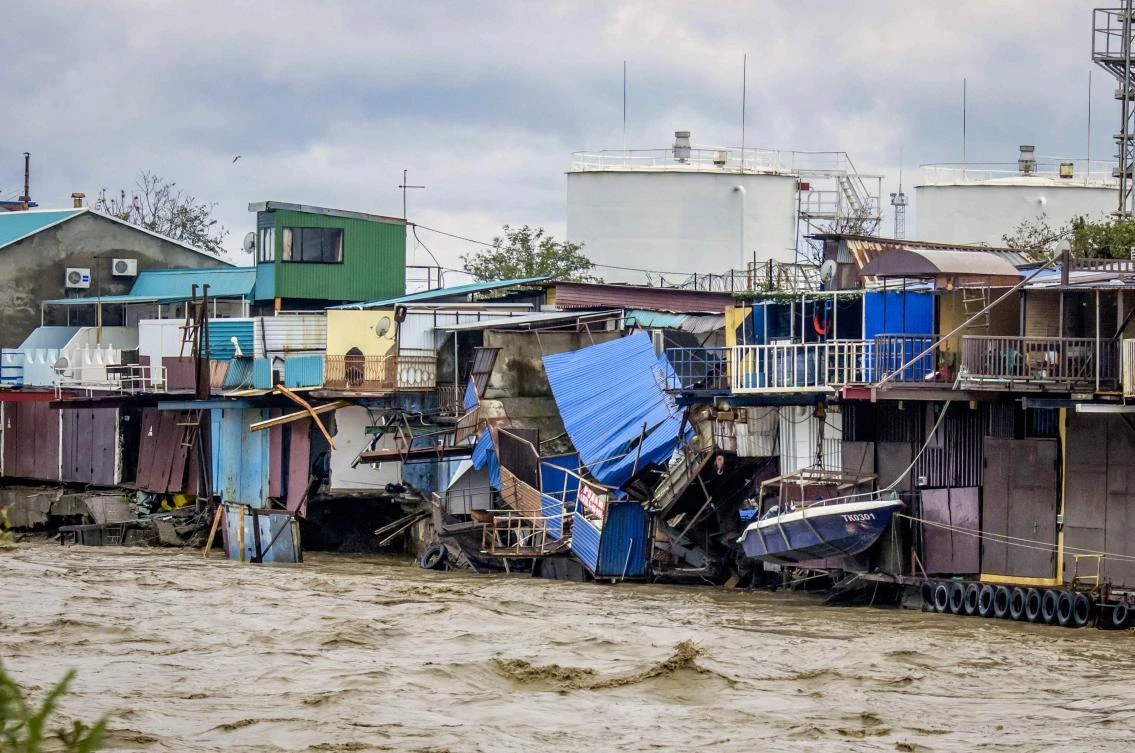 Six people died in floods in southern Russia near the town of Tuapse, above; regional infrastructure including an oil pipeline was also damaged. (AFP)