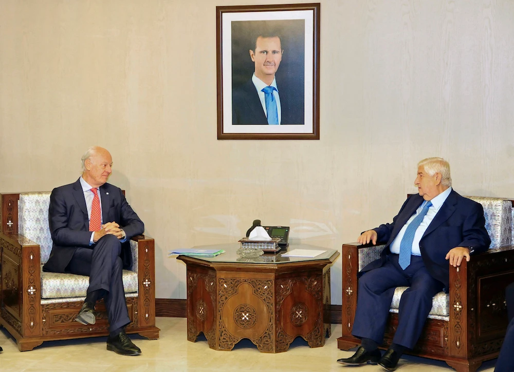 De Mistura (L), a veteran Italian-Swedish diplomat due to step down next month, said Friday that Foreign Minister Walid Muallem (R) rejected the last list of UN-proposed names and suggested his own method to the final 50 members during talks in Damascus this week.