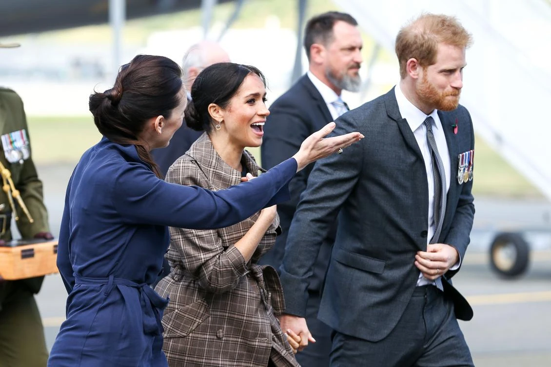 Britain’s Prince Harry and his wife Meghan with New Zealand’s Prime Minister Jacinda Ardern after arriving at the Wellington International Airport Military Terminal in Wellington. (AFP)
