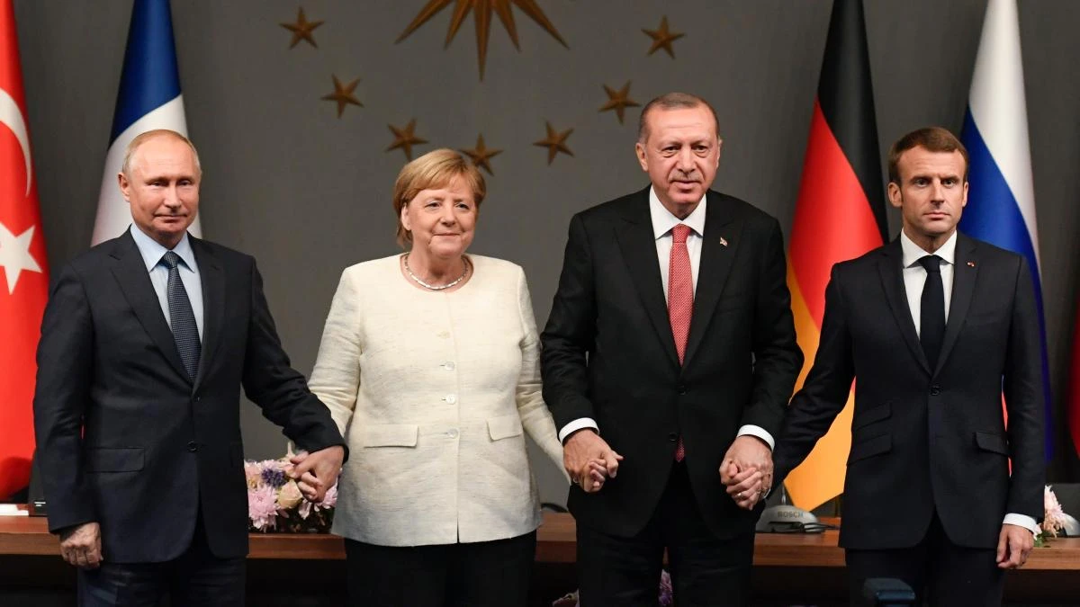 Russian President Vladimir Putin, German Chancellor Angela Merkel, Turkish President Recep Tayyip Erdogan and French President Emmanuel Macron take part in a conference as part of a summit called to attempt to find a lasting political solution to the civil war in Syria. (AFP)