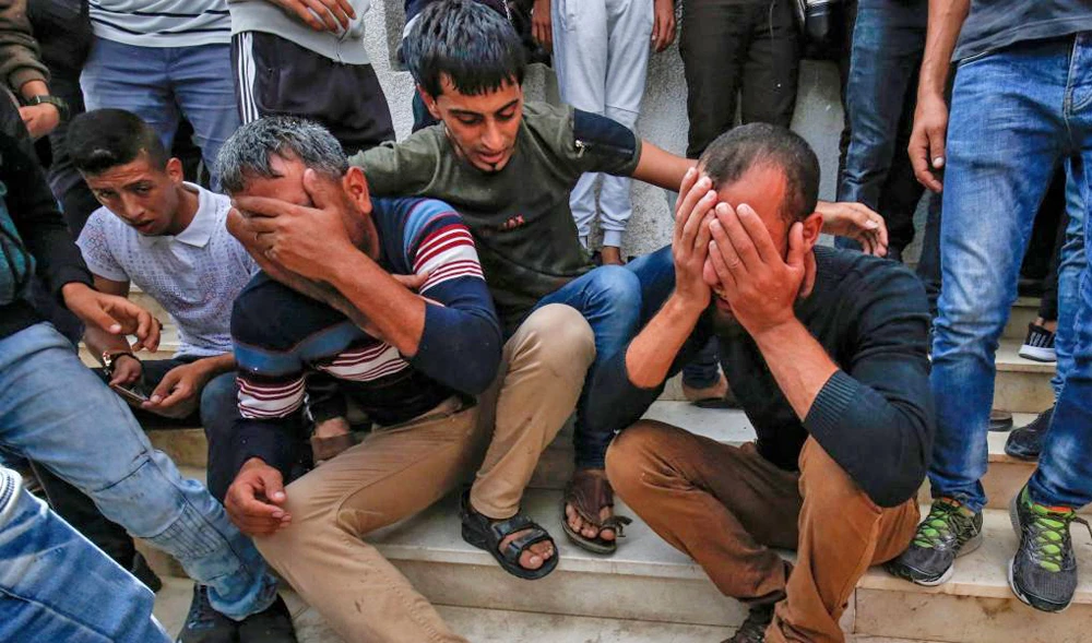 Palestinians mourn the death of their own amid clashes in Gaza. (File/AFP)