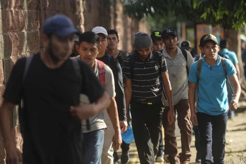 Salvadoran migrants gather in a caravan to start their journey toward the US, at “Salvador del Mundo” square in San Salvador, on October 28, 2018. (AFP)