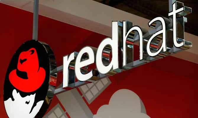 In this file photo taken on February 26, 2018 The logo of Red Hat Software is pictured at the Mobile World Congress (MWC), the world's biggest mobile fairin Barcelona. (AFP)