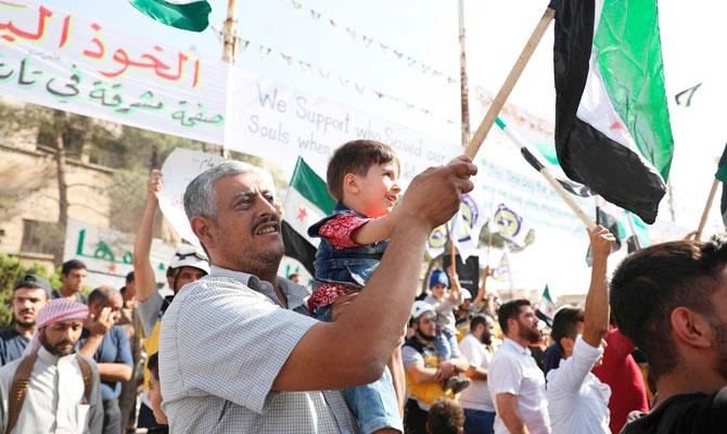 Bahr Nahhas attends a demonstration in the rebel-held town of Maaret al-Numan, in the north of Idlib province on October 19, 2018. (AFP)