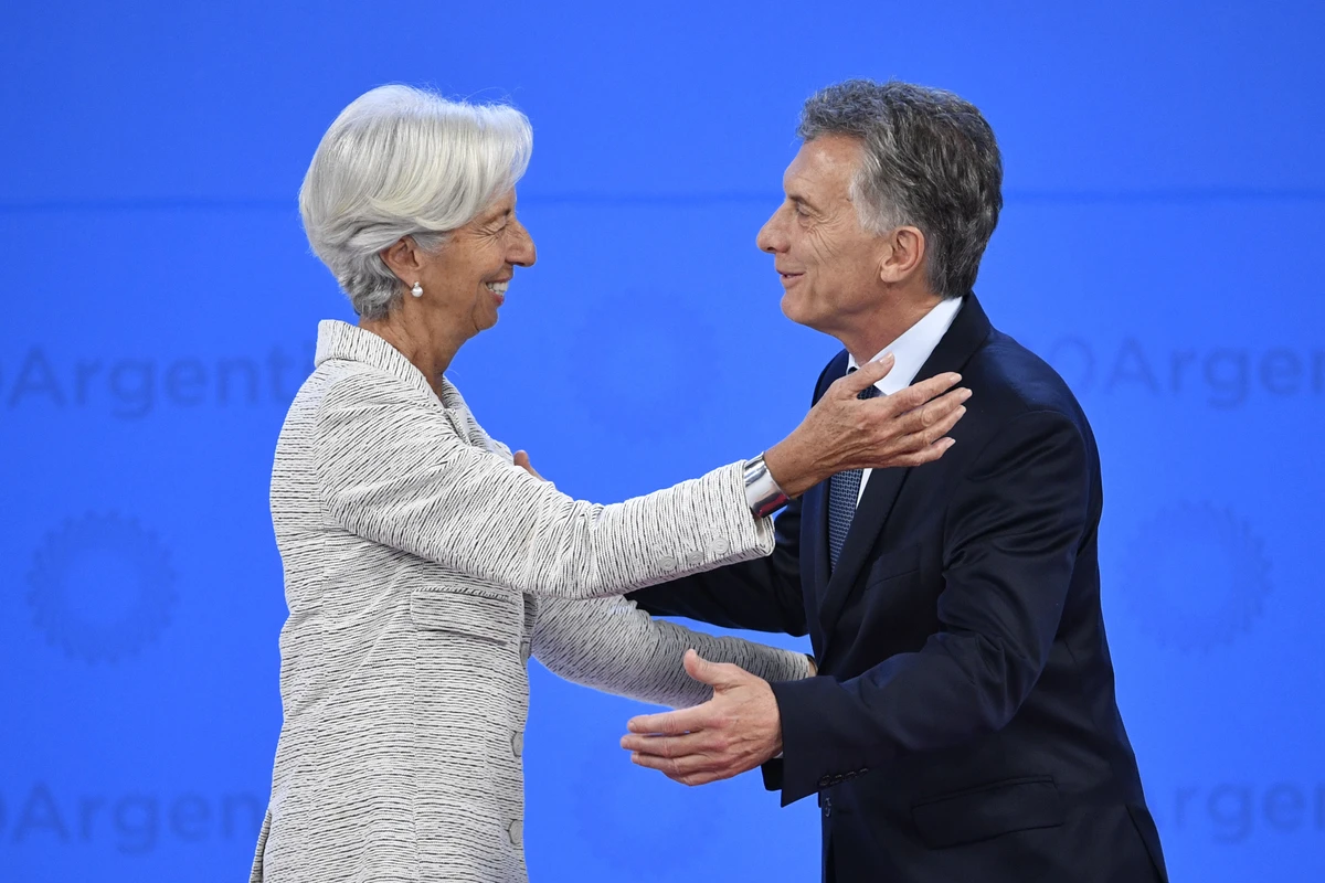 Managing Director of the International Monetary Fund (IMF) Christine Lagarde (L) is welcomed by Argentina's President Mauricio Macri at Costa Salguero in Buenos Aires during the G20 Leaders' Summit, on November 30, 2018. (AFP)