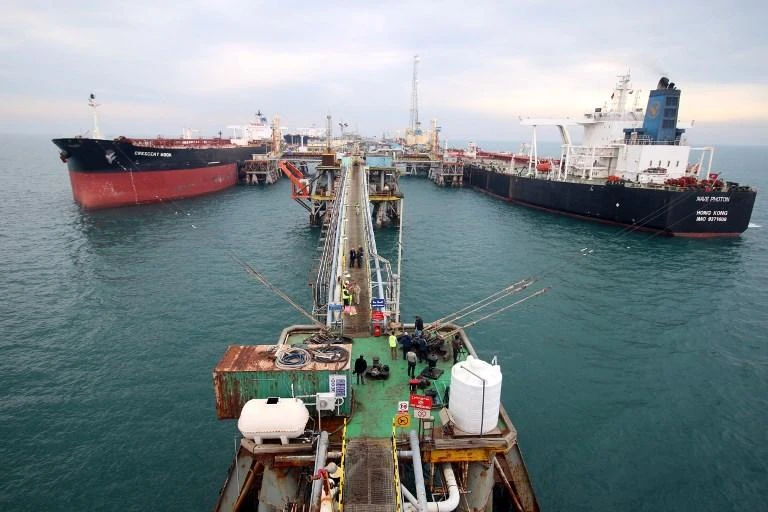 Oil tankers dock at a floating platform, offshore from the southern Iraqi port city of Al-Faw. (AFP)