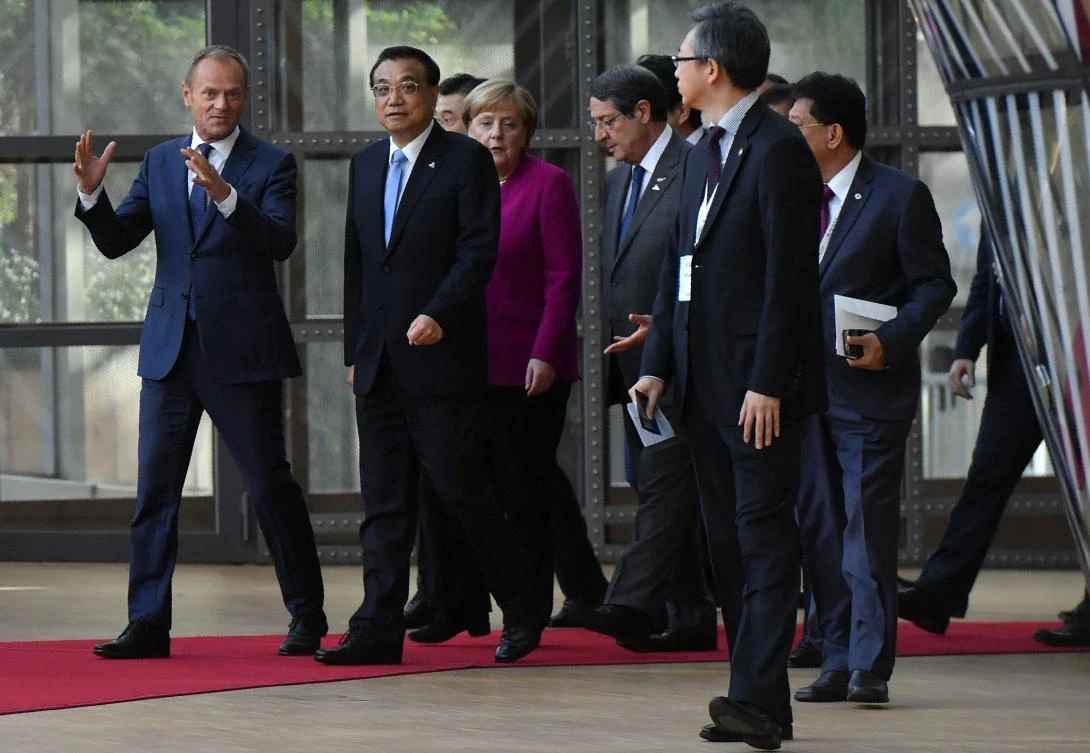 European Council President Donald Tusk (L) and China’s Premier Li Keqiang (C) speak as they walk with other leaders arriving for an ASEM summit at the European Council in Brussels, last month. (AFP)