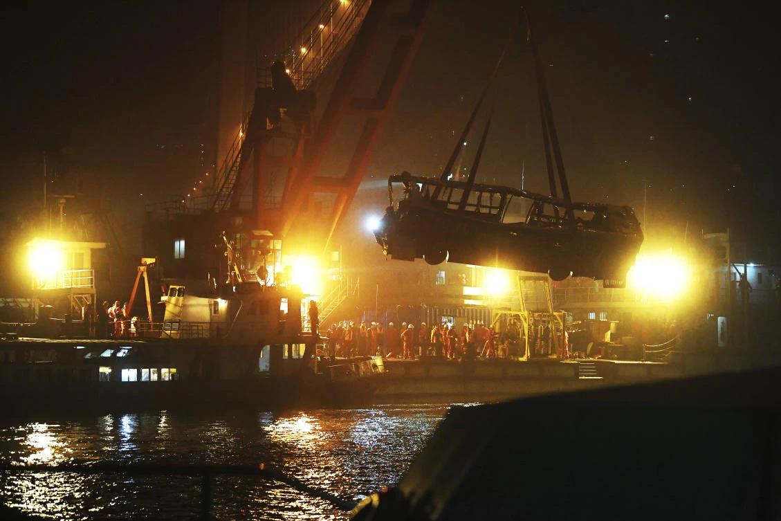 A brawl between a passenger and a bus driver was the cause of the bus plunging off a bridge and killing more than a dozen people in southwestern China on Sunday. (Xinhua via AP)