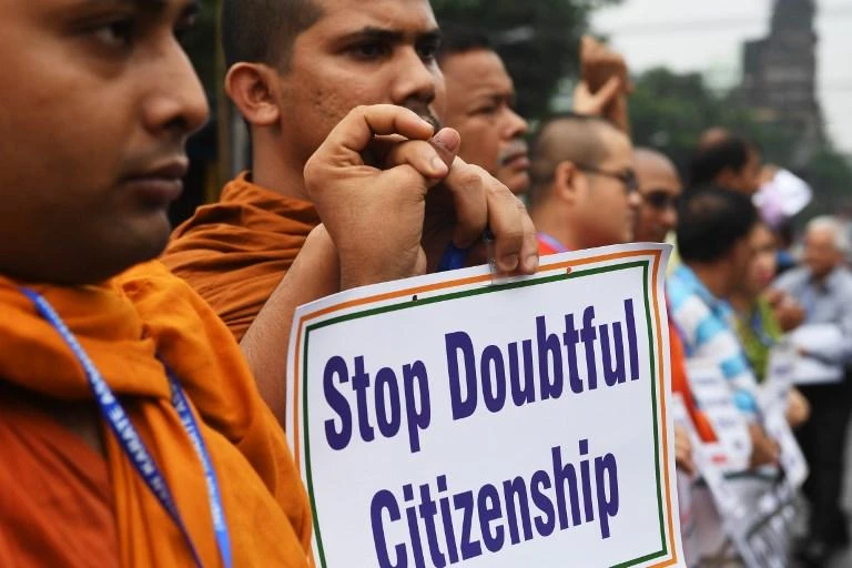 Activists hold posters during a protest following the publication of a draft of the National Register of Citizens in Kolkata on August 1. (AFP)