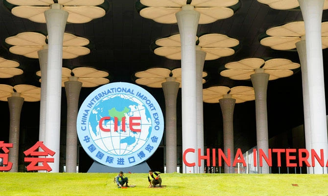In this Oct. 26, 2018, photo, workers prepare a lawn outside the venue for the upcoming China International Import Expo in Shanghai. (AP)