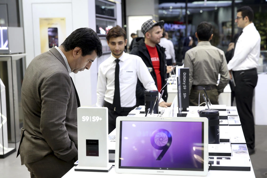 A customer looks at items in an electronics shopping mall in downtown Tehran, Iran. (AP)