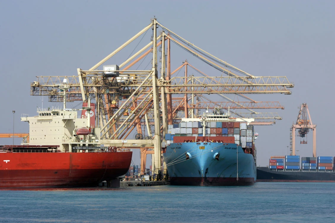 Cranes unload containers in Jeddah Islamic Port. Business optimism in future output has risen markedly. (AFP)