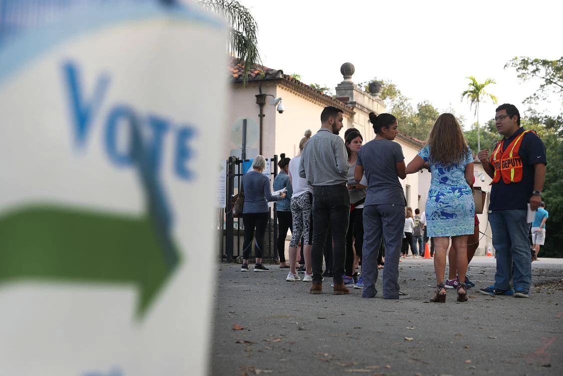 Voters line up to cast their ballots in Miami. (AFP)