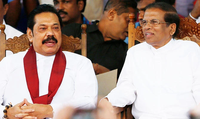 Sri Lanka's newly appointed Prime Minister Mahinda Rajapaksa and President Maithripala Sirisena talk during a rally near the parliament in Colombo, Sri Lanka, in this November 5, 2018 photo. (REUTERS)