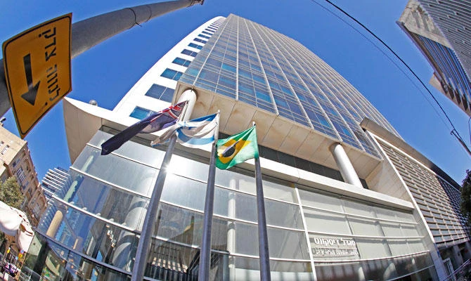 A photo taken on October 28, 2018, shows the Israeli and Brazilian flags hanging outside the building housing the offices of the Brazilian Embassy, in the Israeli city of Tel Aviv. (AFP)