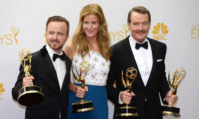 In this file photo taken on August 26, 2014, actors Aaron Paul (L), Anna Gunn (C) and Bryan Cranston (R) pose in the press after winning the Outstanding Drama Series Award, Outstanding Lead Actor in a Drama Series Award, Outstanding Supporting Actor in a Drama Series Award and Outstanding Supporting Actress in a Drama Series Award for "Breaking Bad" during the 66th Emmy Awards in Los Angeles. (AFP)